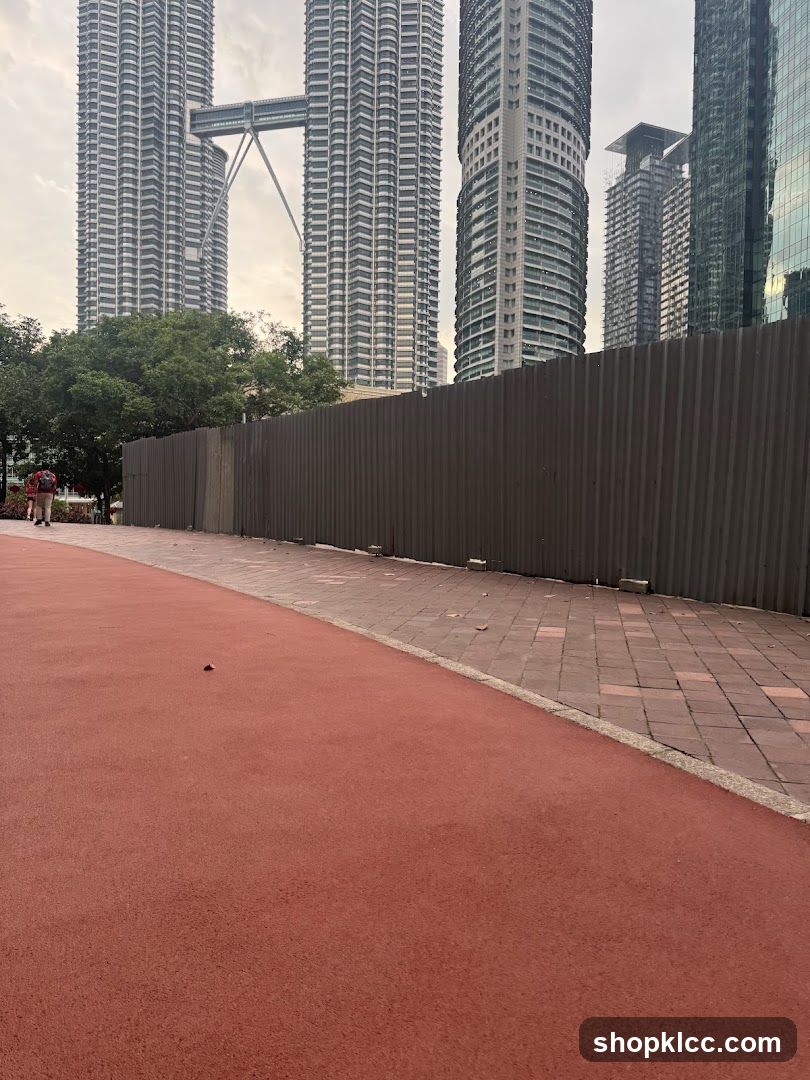 Cityscape with Twin Towers and Construction Barrier