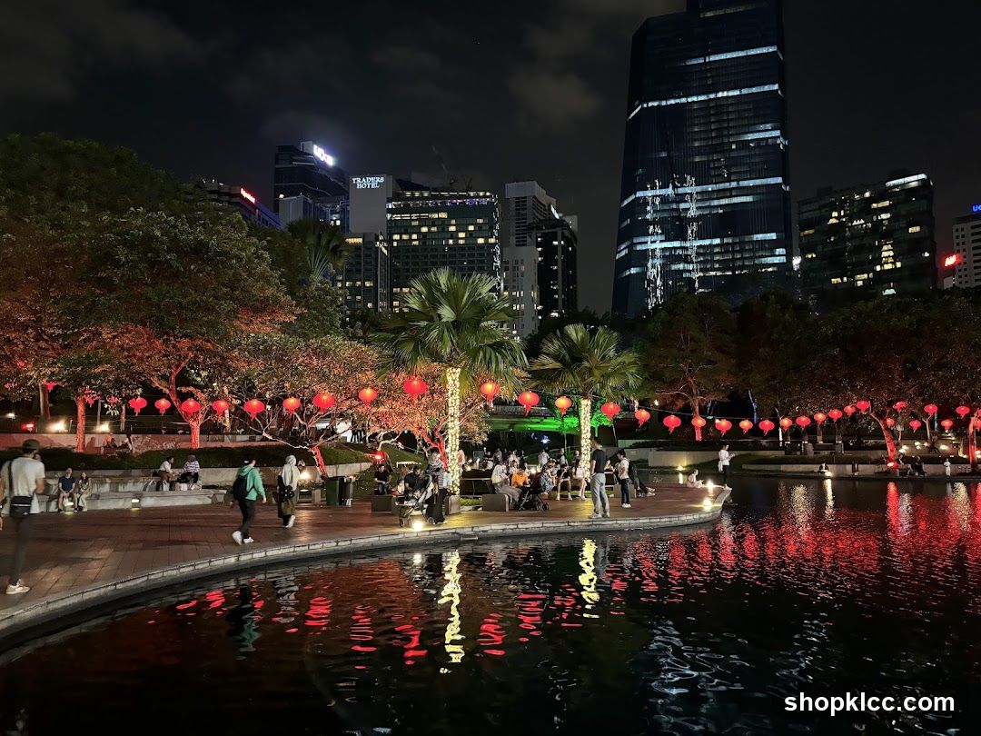Nighttime park with lanterns and city skyline