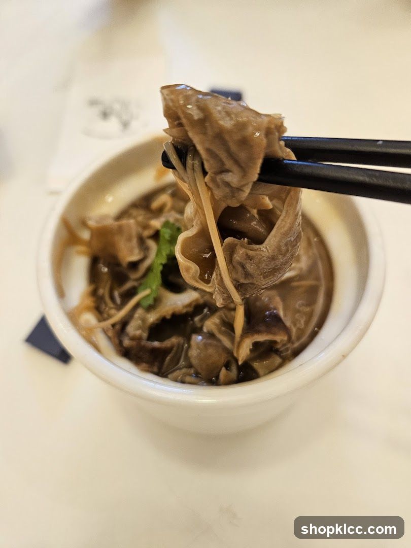 Close-up of Food Being Eaten with Chopsticks