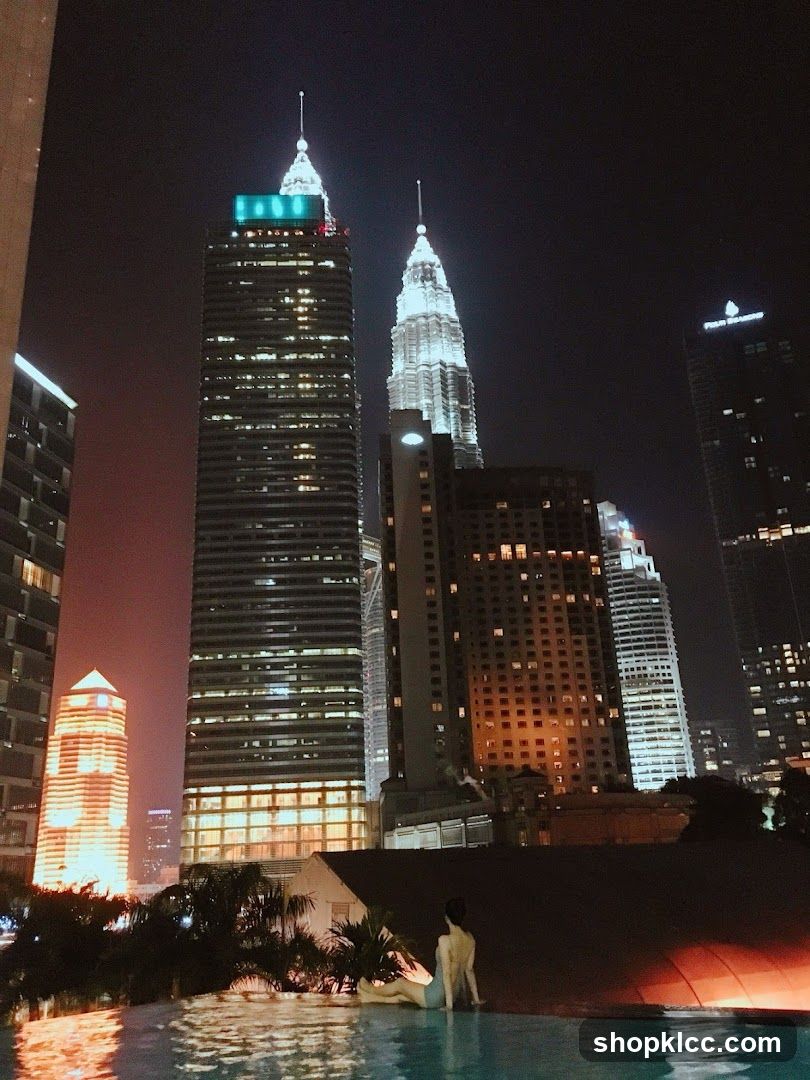 Nighttime Cityscape with Infinity Pool