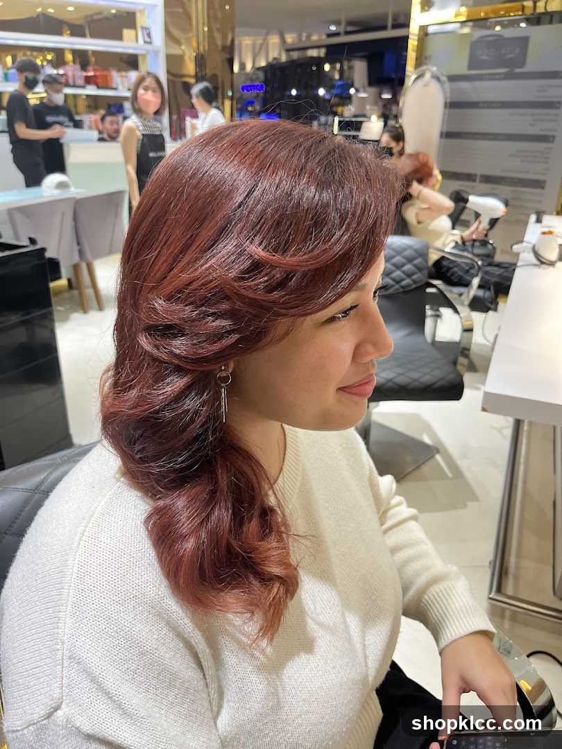 Woman with Reddish-Brown Hair in Salon