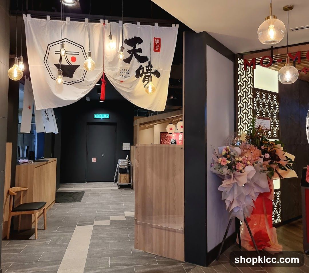 Restaurant Entrance with Noren and Floral Arrangement