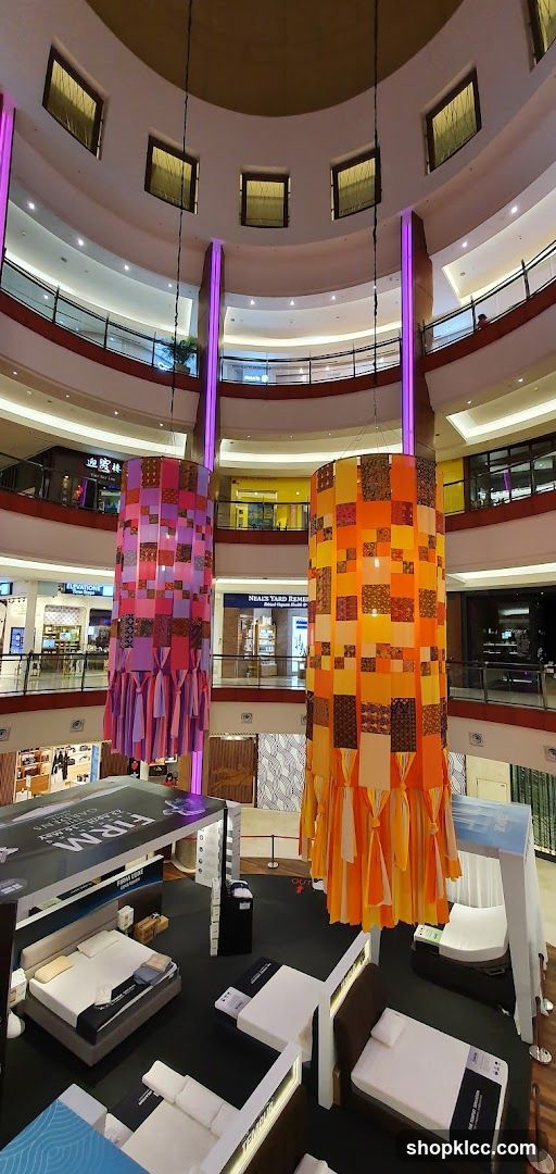 Mall Interior with Decorative Pillars and Bed Displays