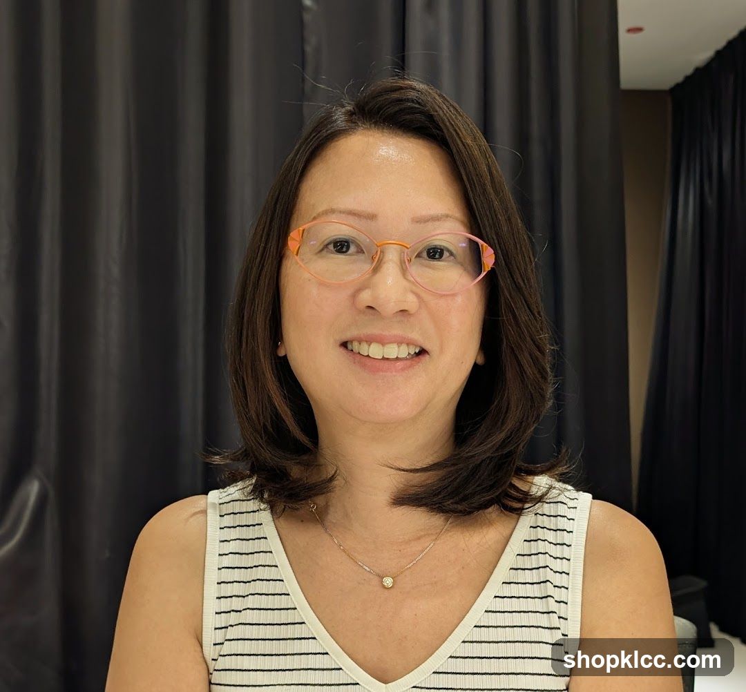 Woman wearing glasses and a striped top