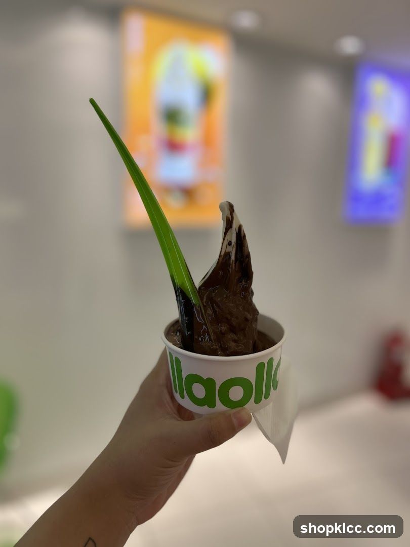 Chocolate frozen yogurt with a green spoon
