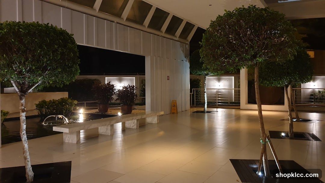 Outdoor Seating Area with Fountain and Trees