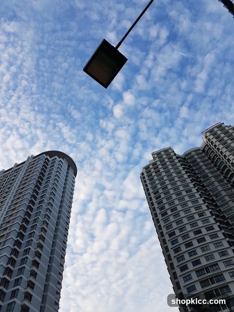 Tall buildings under a cloudy sky