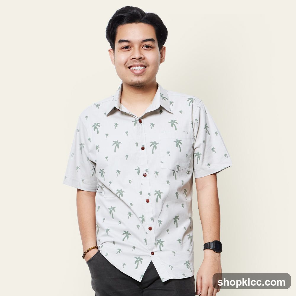 Man in a palm tree print shirt