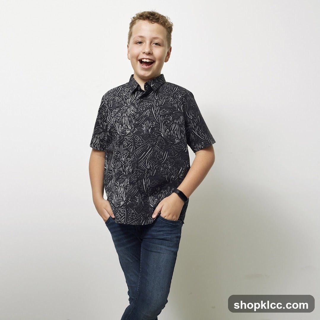 Boy in patterned shirt and jeans