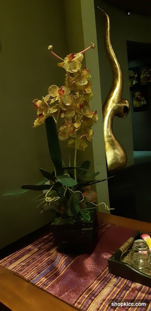 Orchid Arrangement and Decorative Sculpture