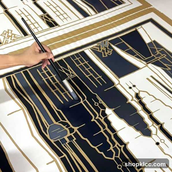 Artist painting a geometric design