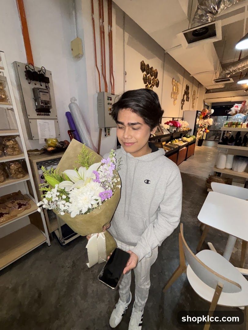 Person holding a bouquet of flowers