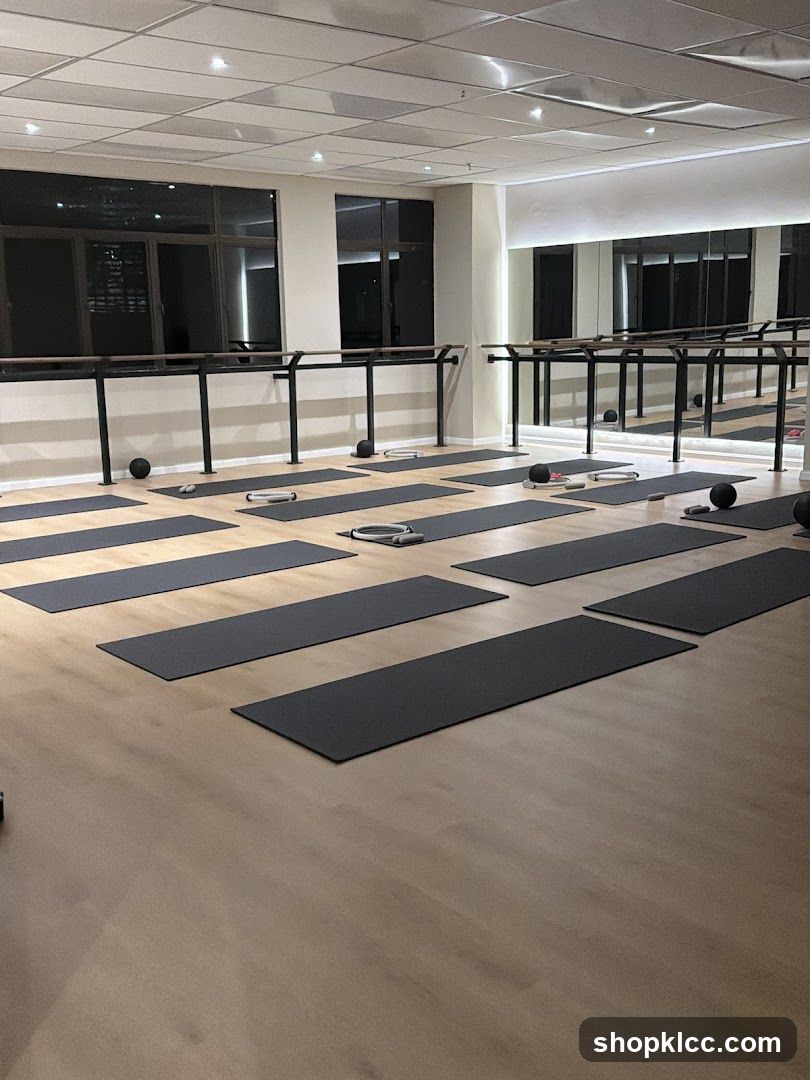 Fitness Studio with Yoga Mats and Barre