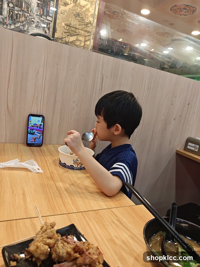 Child Eating at Restaurant
