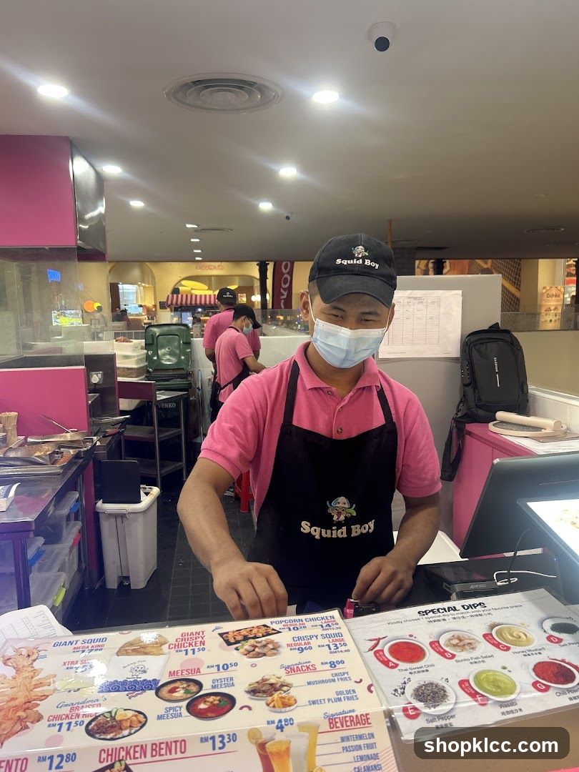 Squid Boy Staff at Counter