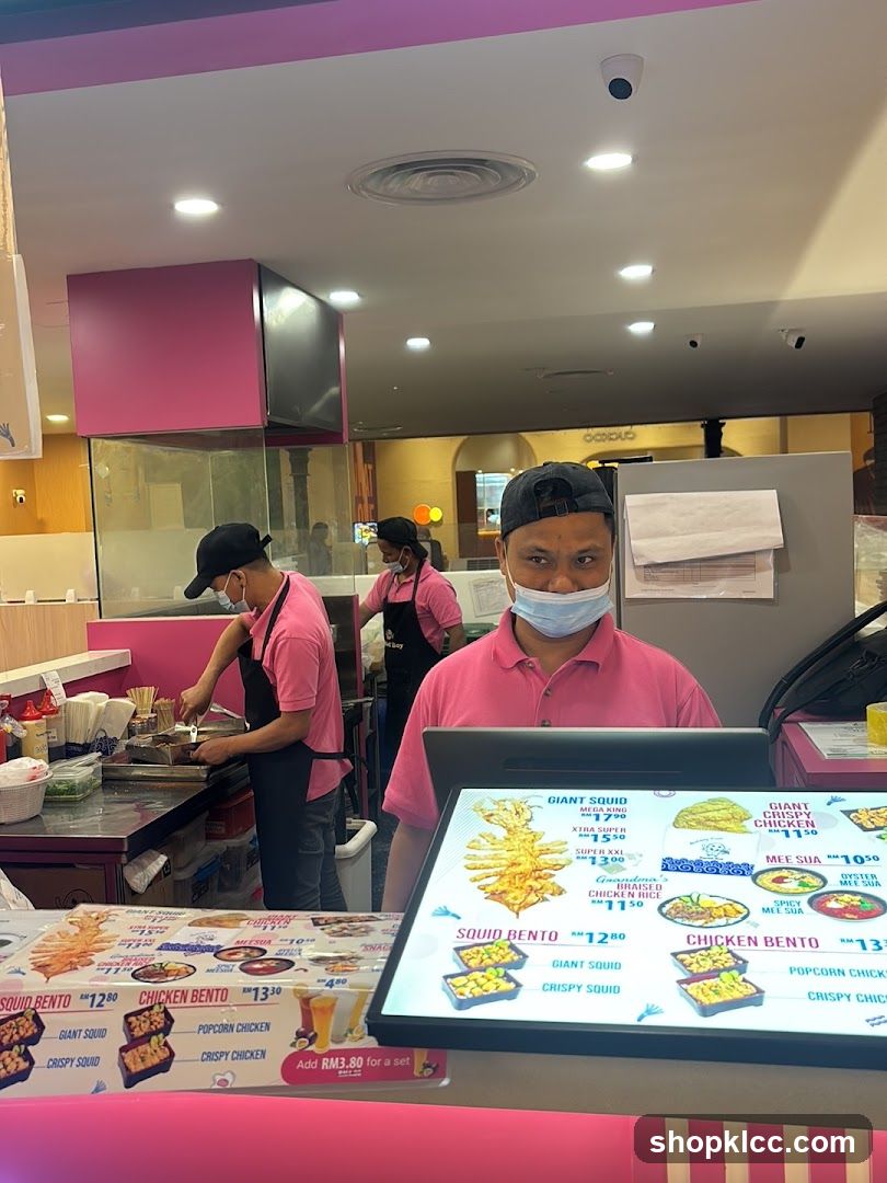 Food Stall Interior with Staff and Menu Display