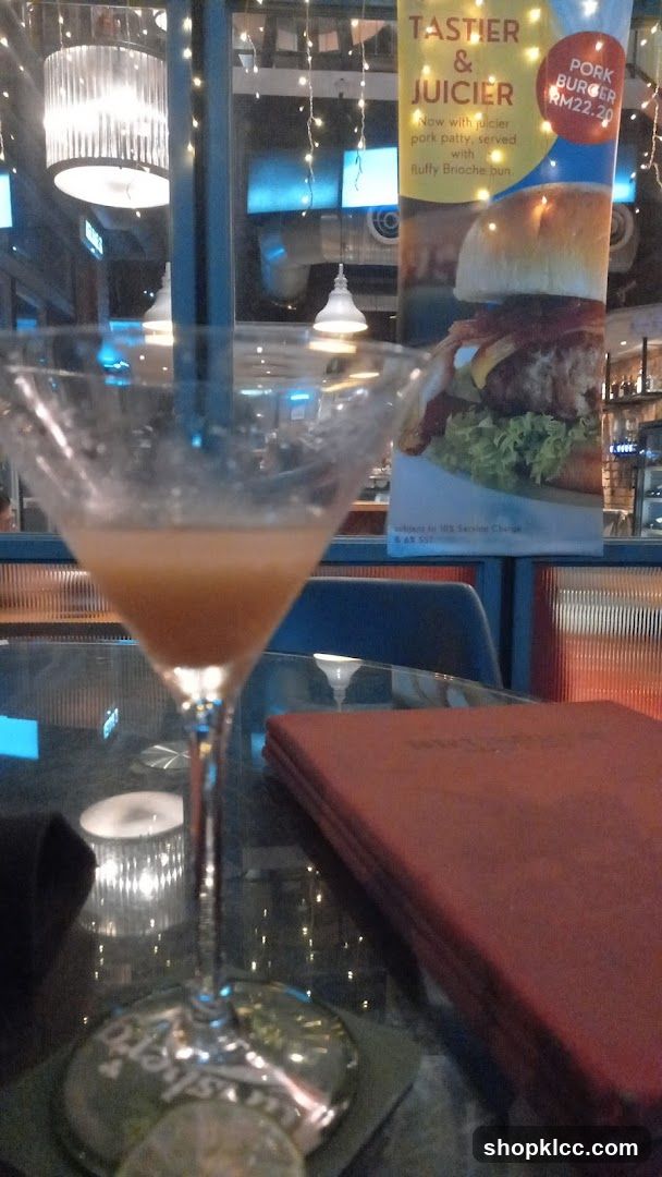 Dining Scene with Cocktail and Menu