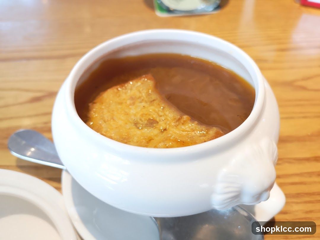 Soup in a white bowl with bread