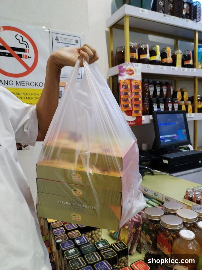 Person holding a bag of dates