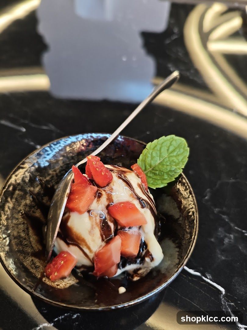 Ice Cream with Strawberries and Chocolate Sauce