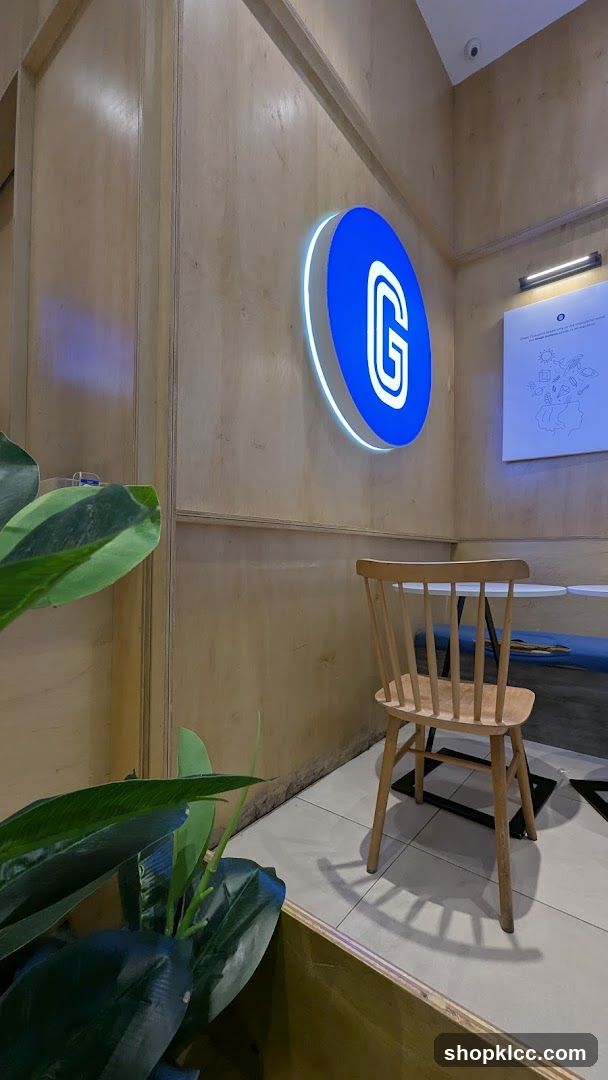 Interior of a cafe with a large illuminated logo