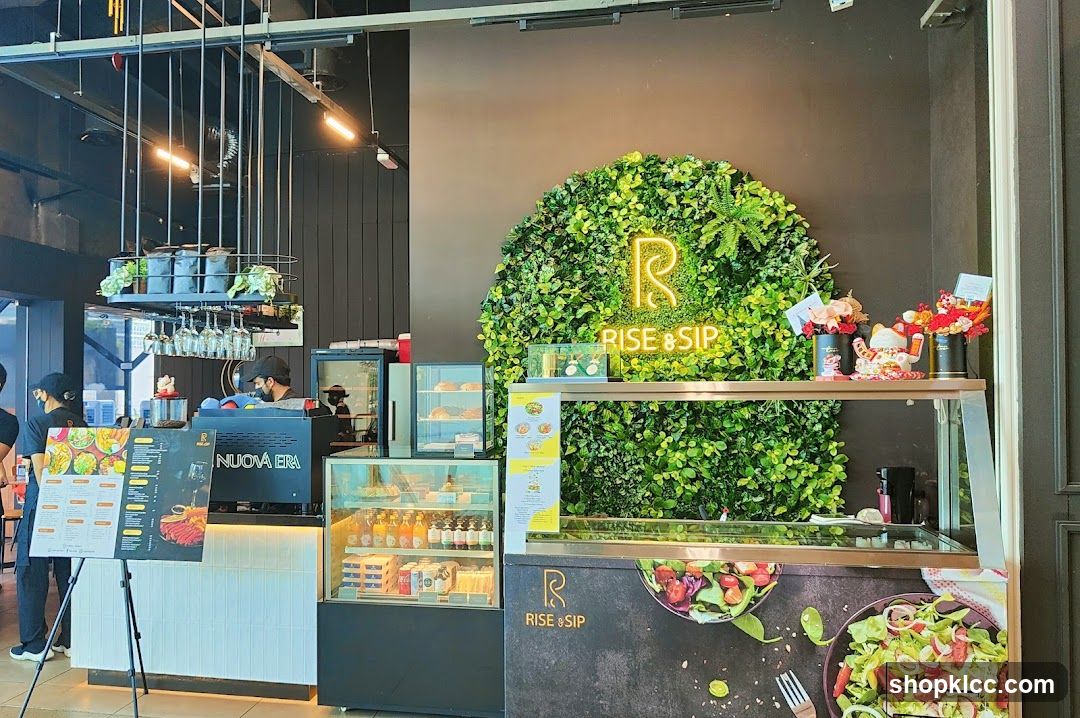Cafe Interior with Green Wall and Neon Sign