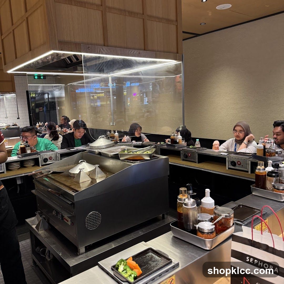 Diners at a Counter with Cooking Station