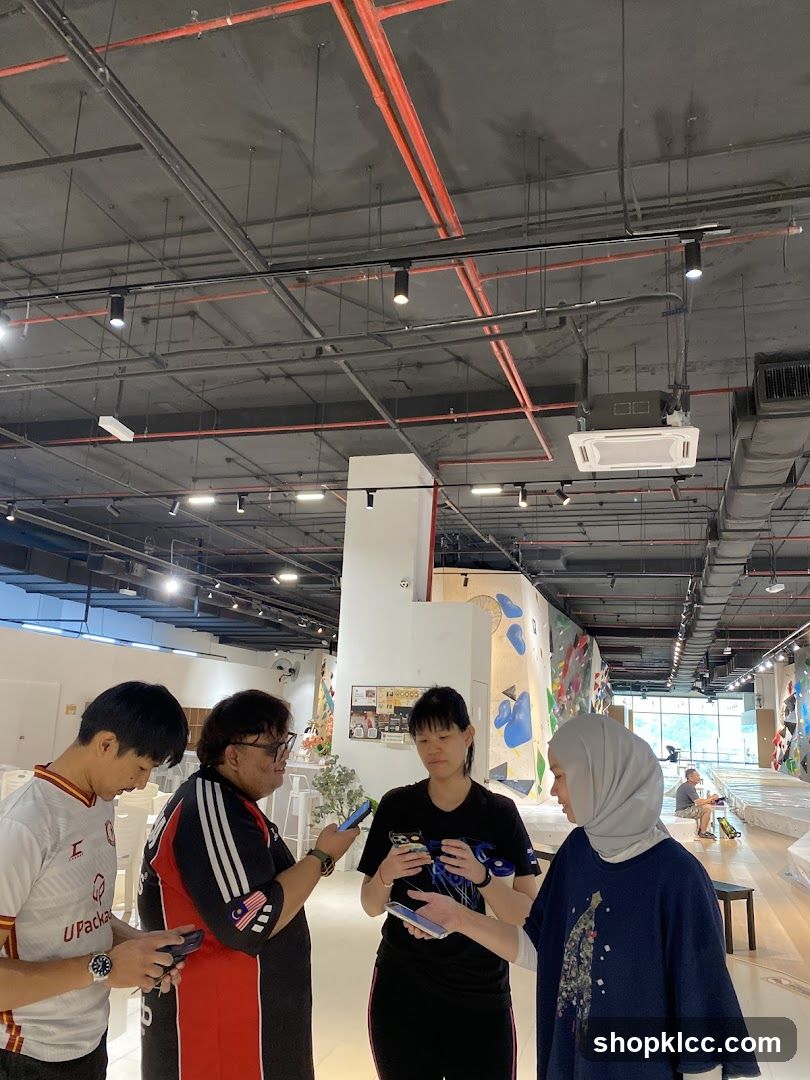 People gathered in a climbing gym