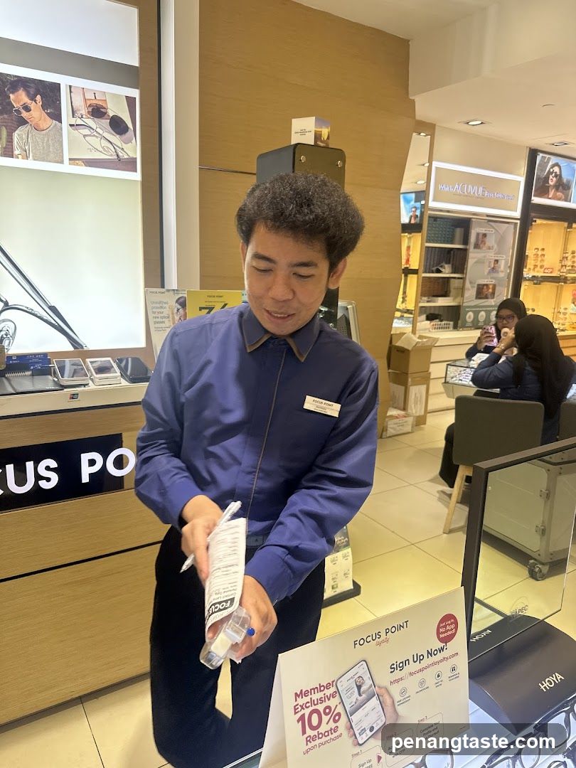 Optician assisting customer