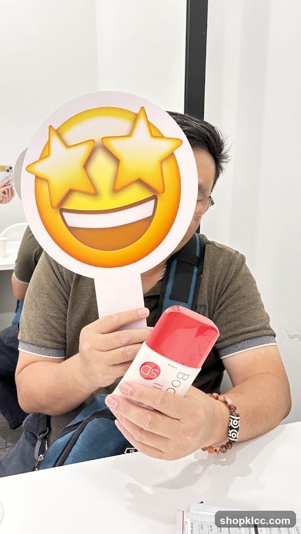 Person holding a product and an emoji sign
