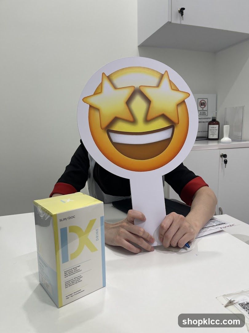 Person holding an emoji sign