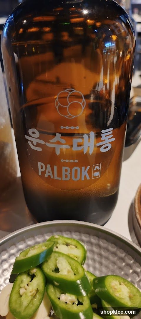 Bottle with Korean text and sliced jalapeños