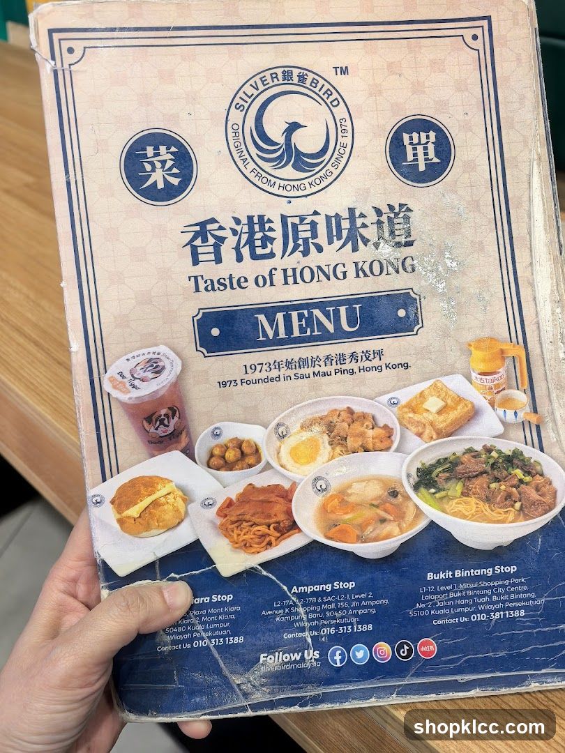 Hand holding restaurant menu