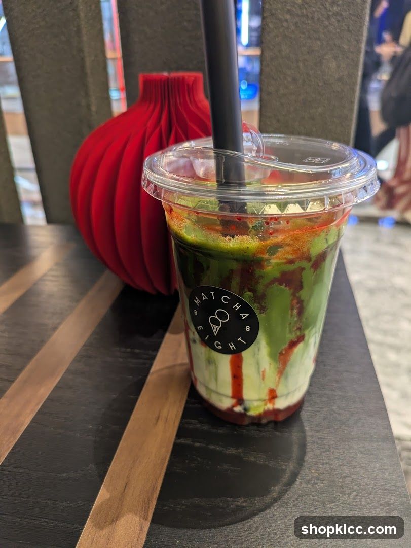 Matcha Drink with Red Swirls