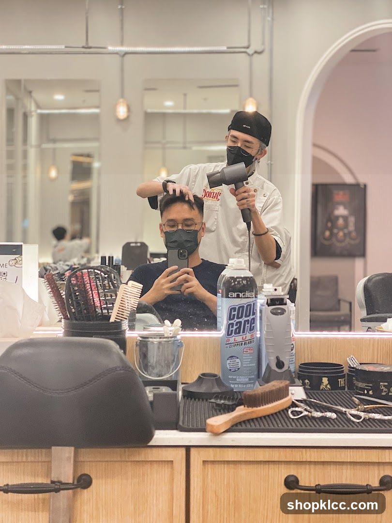 Barber drying client's hair