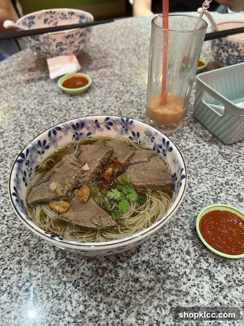 Beef noodle soup with a drink