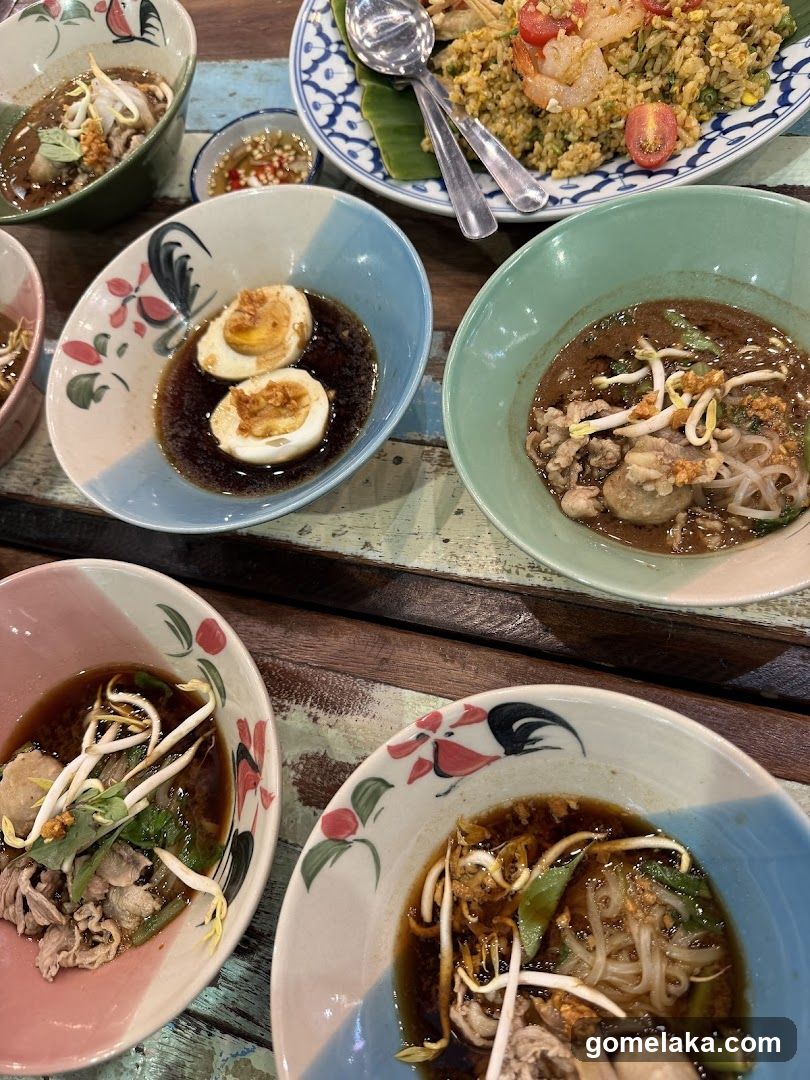 Table with Thai dishes