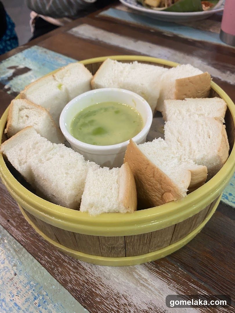 Bread and dipping sauce in a wooden bowl