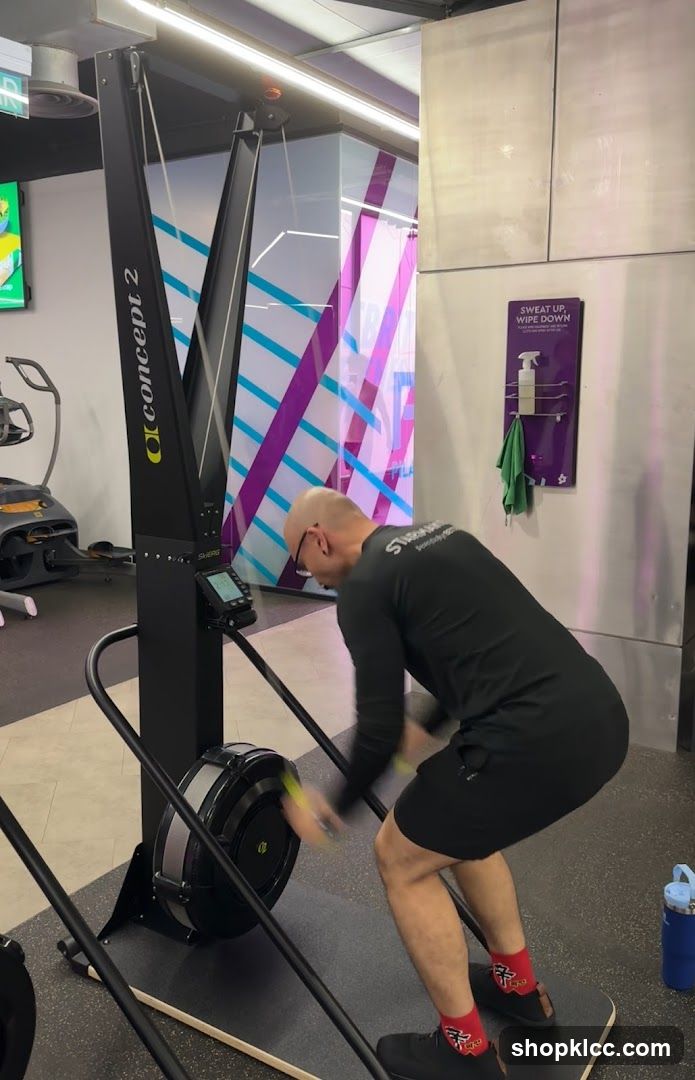 Man using a ski erg machine