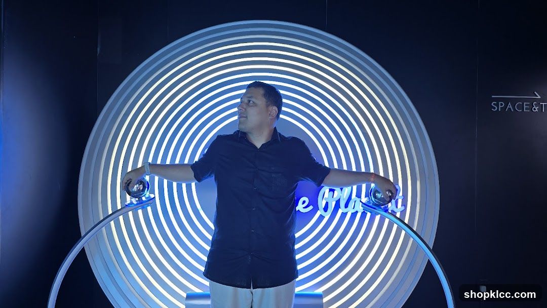 Man Posing with Neon Art Installation