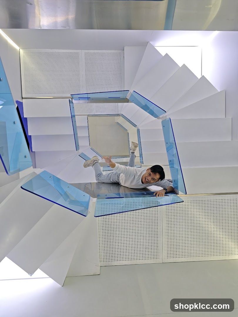 Man posing on a modern staircase