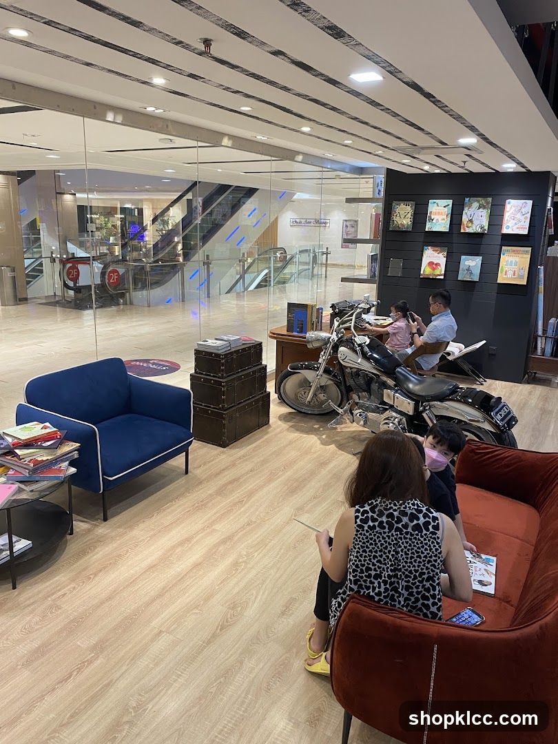 Interior of a bookstore with seating and a motorcycle