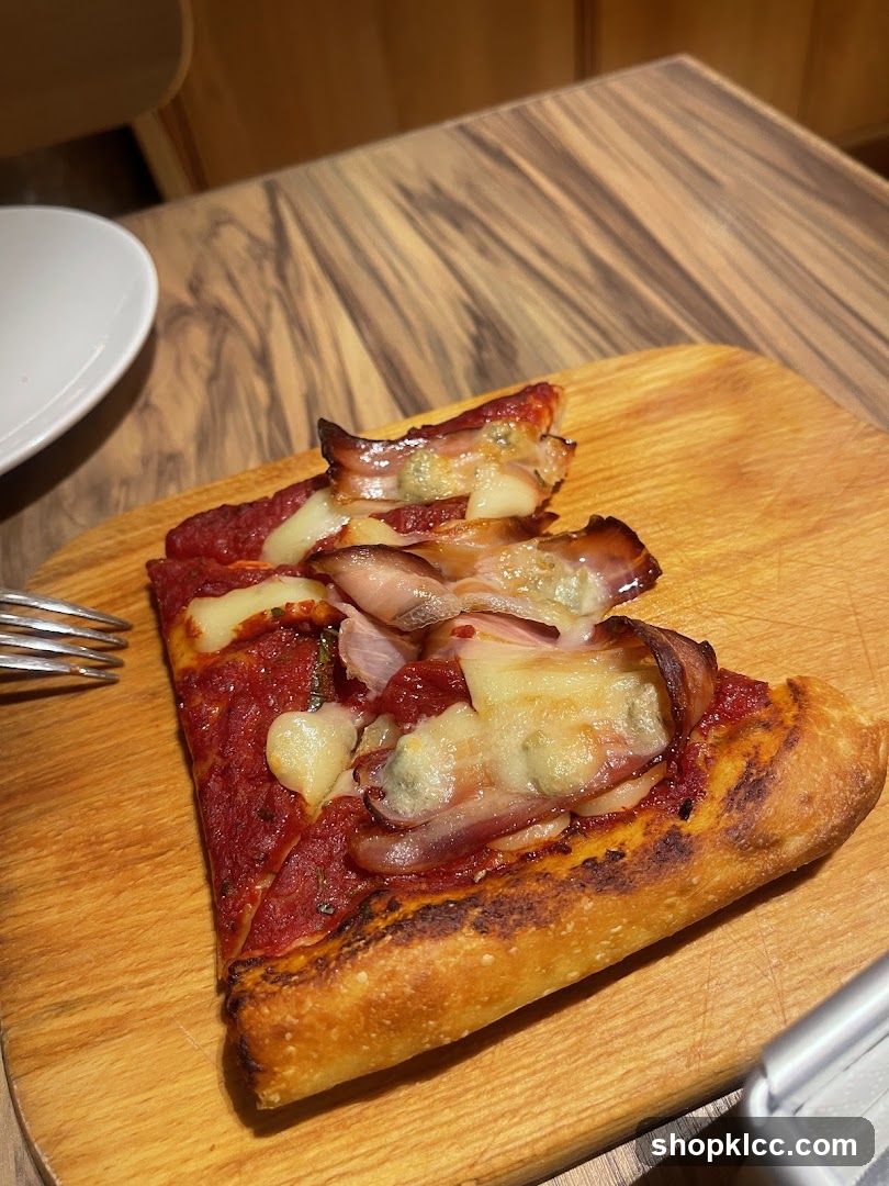 Pizza Slice on Wooden Board