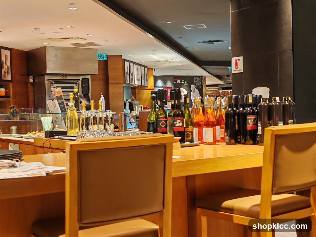 Bar Counter with Wine Bottles and Chairs