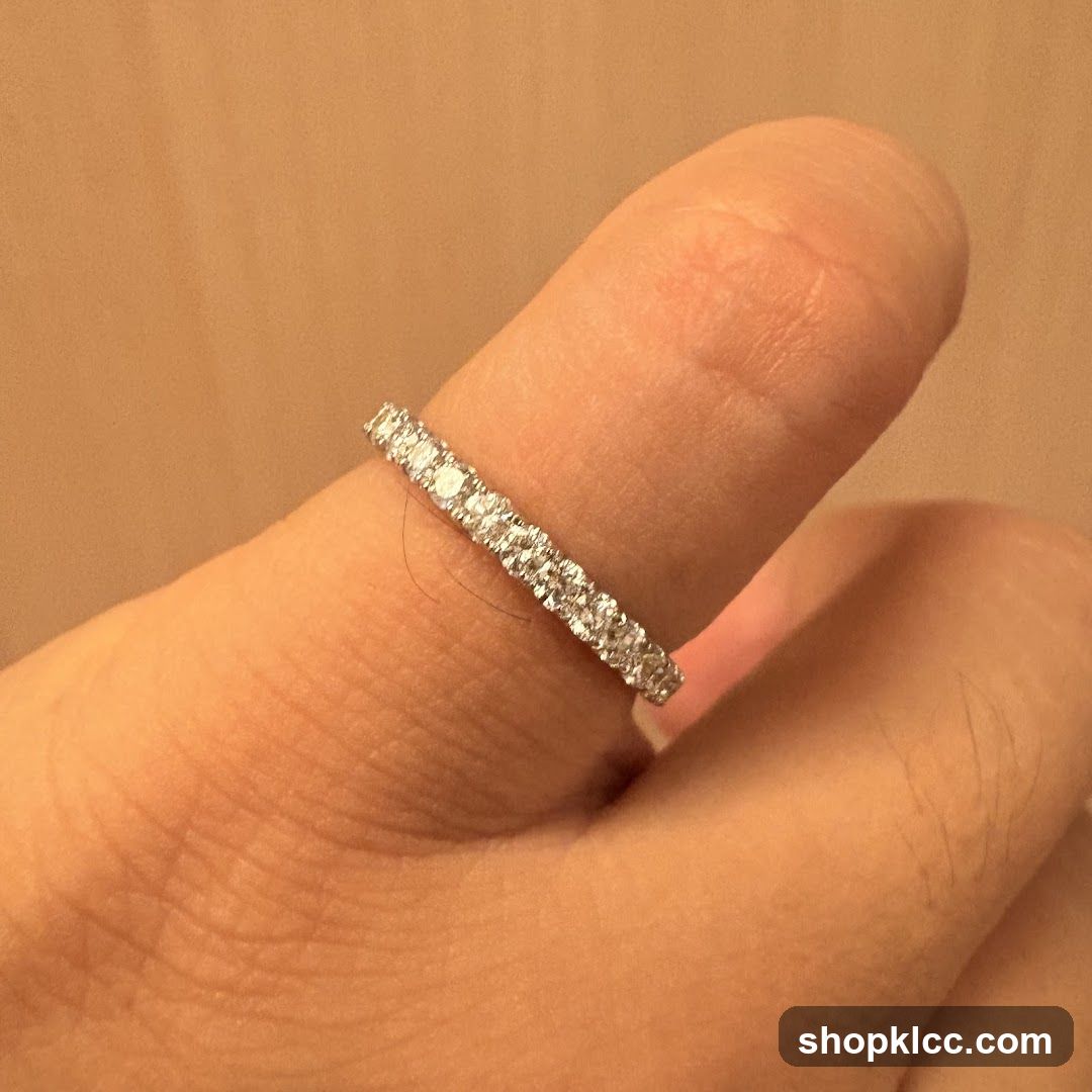 Diamond eternity ring on a finger