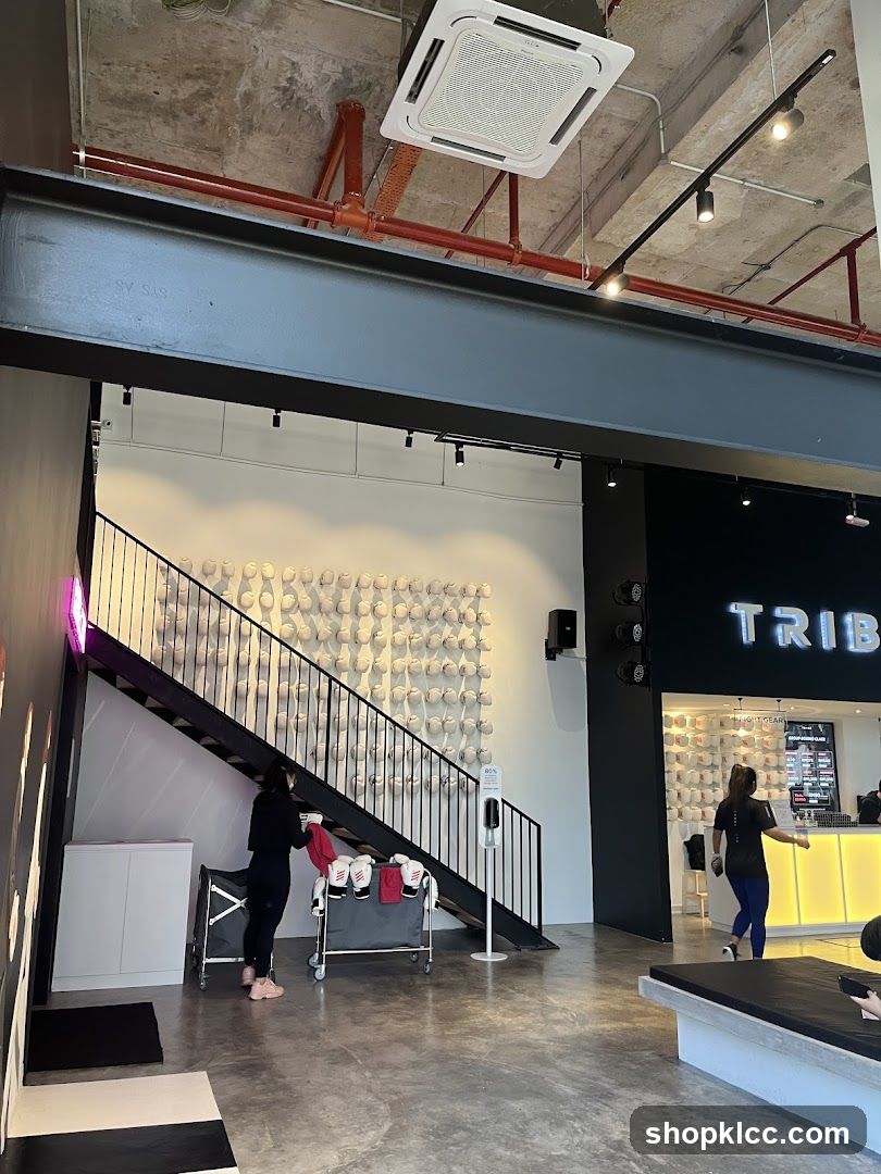 Interior of a gym with a reception desk and workout gear