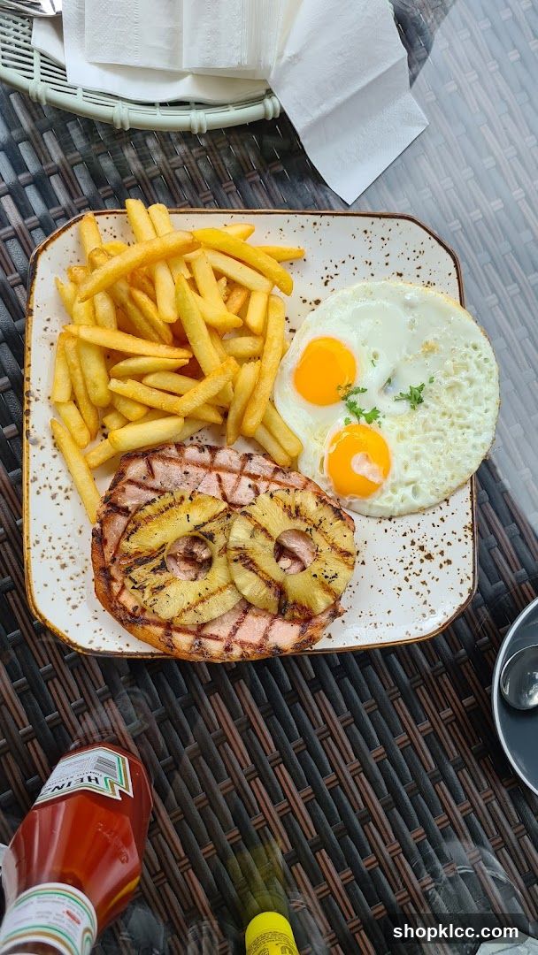 Ham Steak with Pineapple, Eggs, and Fries