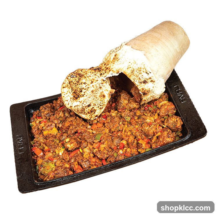 Sizzling Meat Dish with Bread