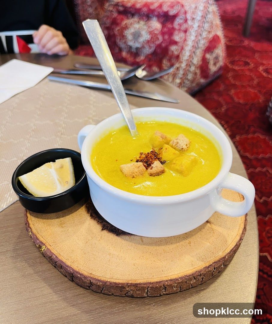 Soup with Croutons and Lemon Wedge