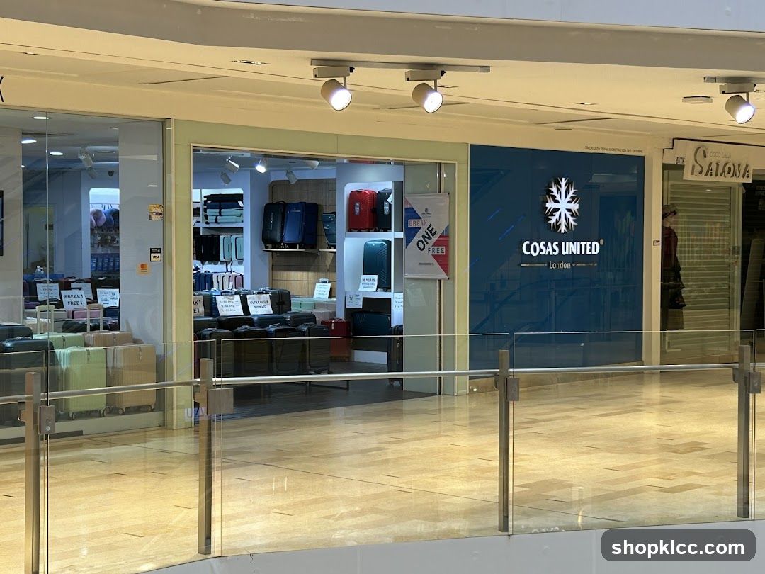 A storefront with a large blue facade displaying the logo and name "COSAS UNITED London". To the left, a shop window displays various suitcases. To the right, another shop front is partially visible.